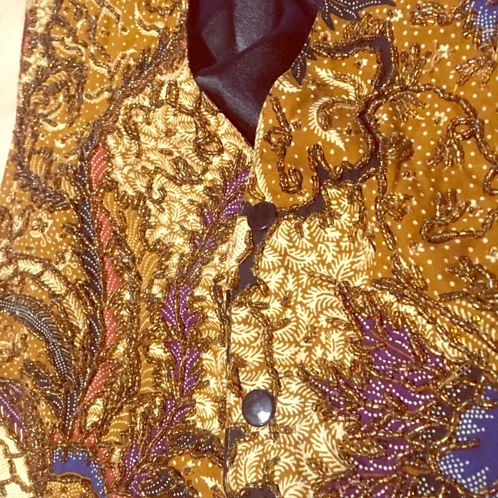 Beaded woman’s snap button vest.